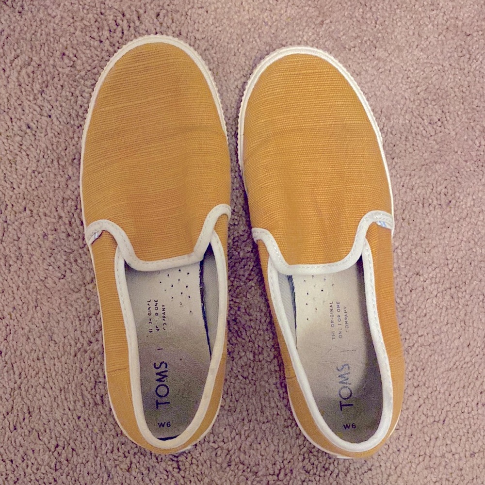 Toms yellow slip on sneakers. Worn but in great condition! Very comfortable